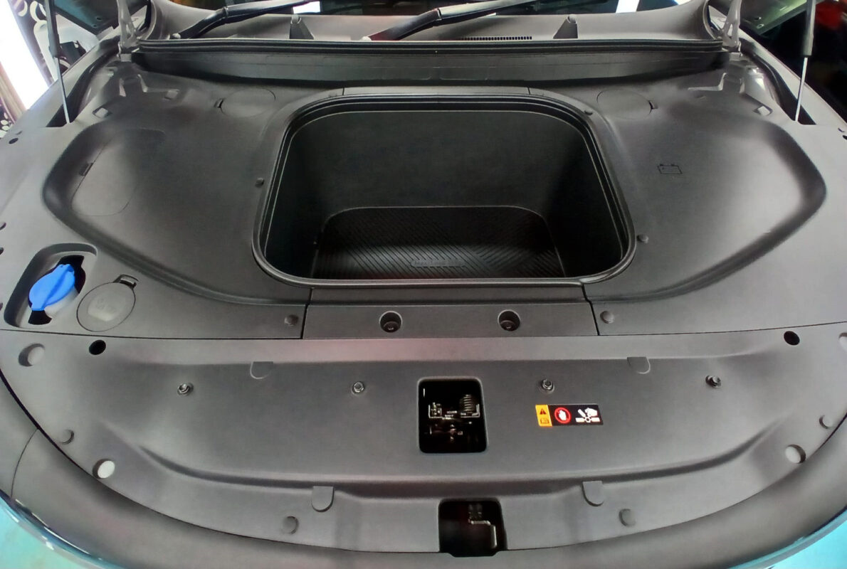 The Kia EV5 parked in the workshop, freshly coated.
