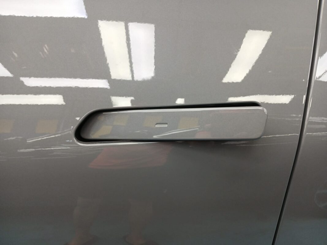 Front three-quarter view of the Kia EV5 after coating.