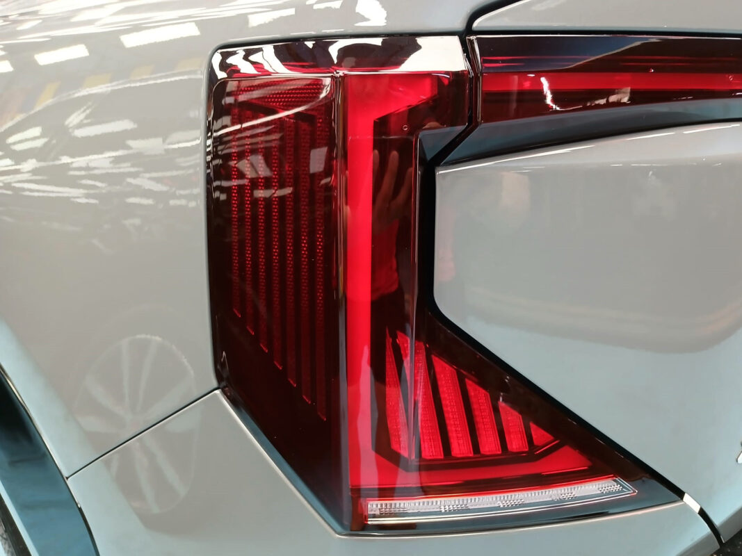Coated bonnet of the EV5 under workshop lighting.
