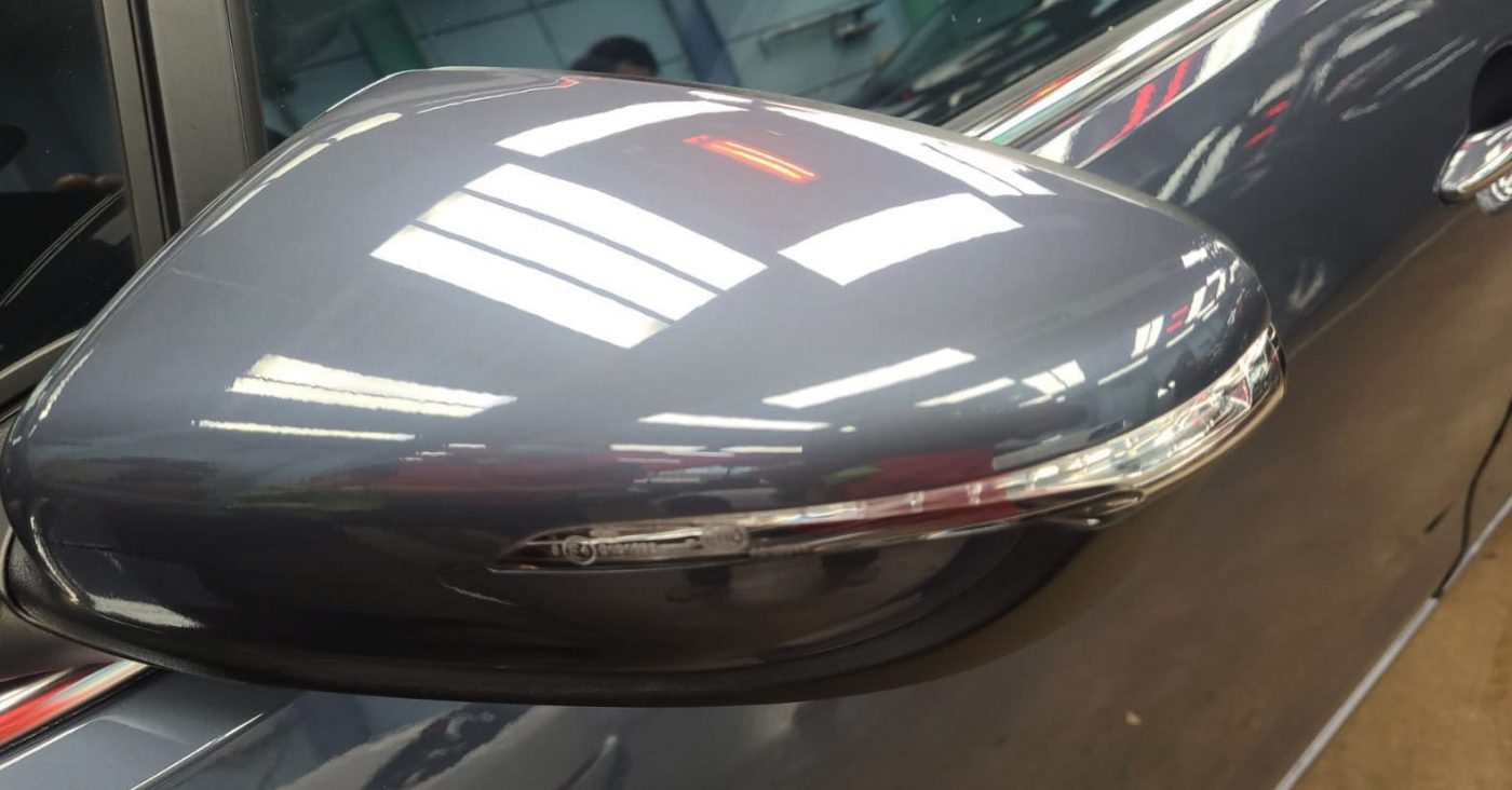 Rear quarter of the Kia Forte K3, glossy and protected.