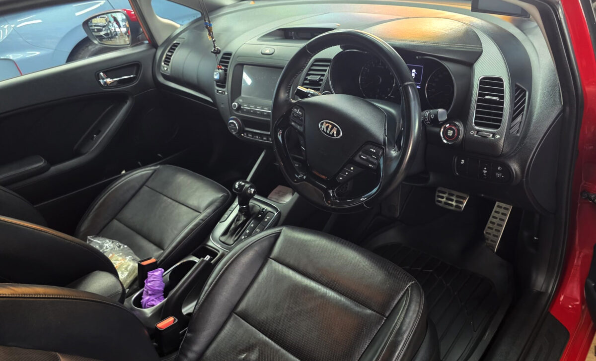 The Kia Forte K3 parked in the workshop, freshly coated.
