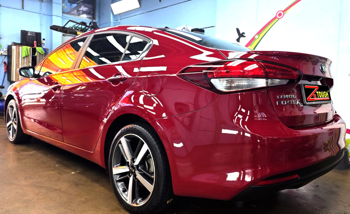 Rear quarter of the Kia Forte K3, glossy and protected.