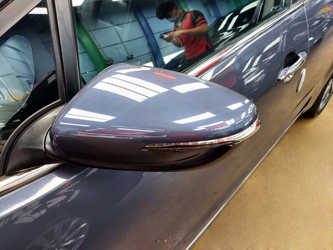 Rear quarter of the Kia Forte K3, glossy and protected.