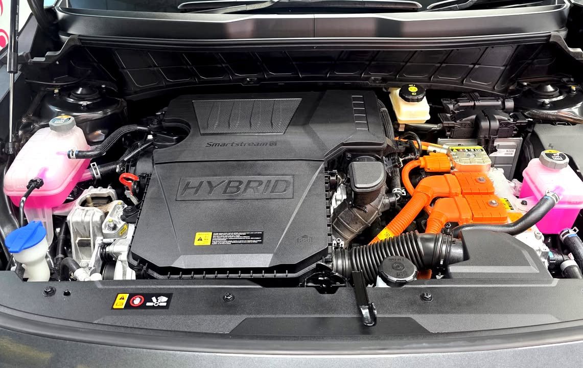 Engine bay with the hybrid engine cover.