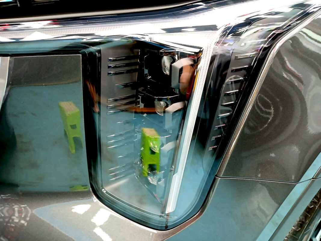 The Sorento's coated paintwork holding clean reflections.