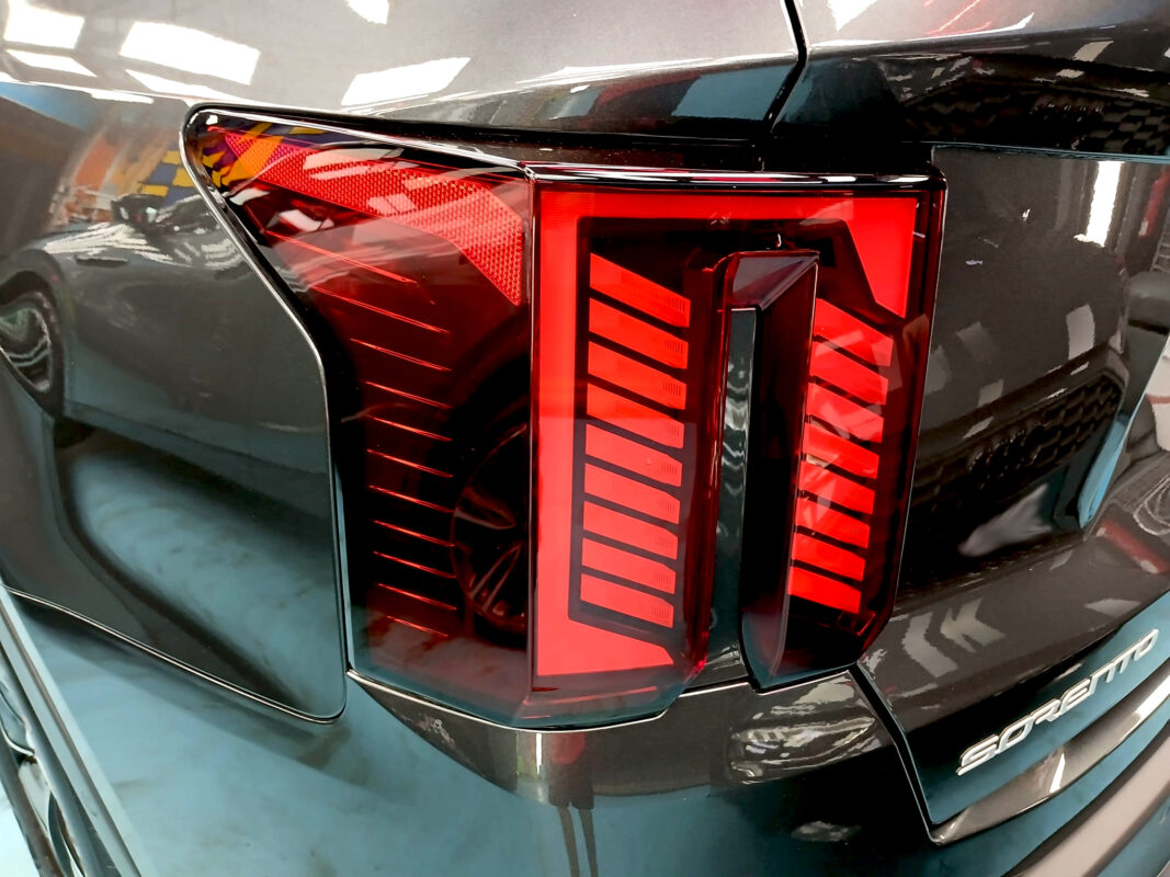 Rear quarter of the Kia Sorento, glossy and protected.
