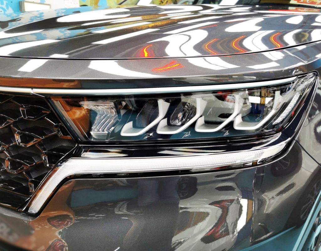 The Sorento's coated paintwork showing clean reflections.