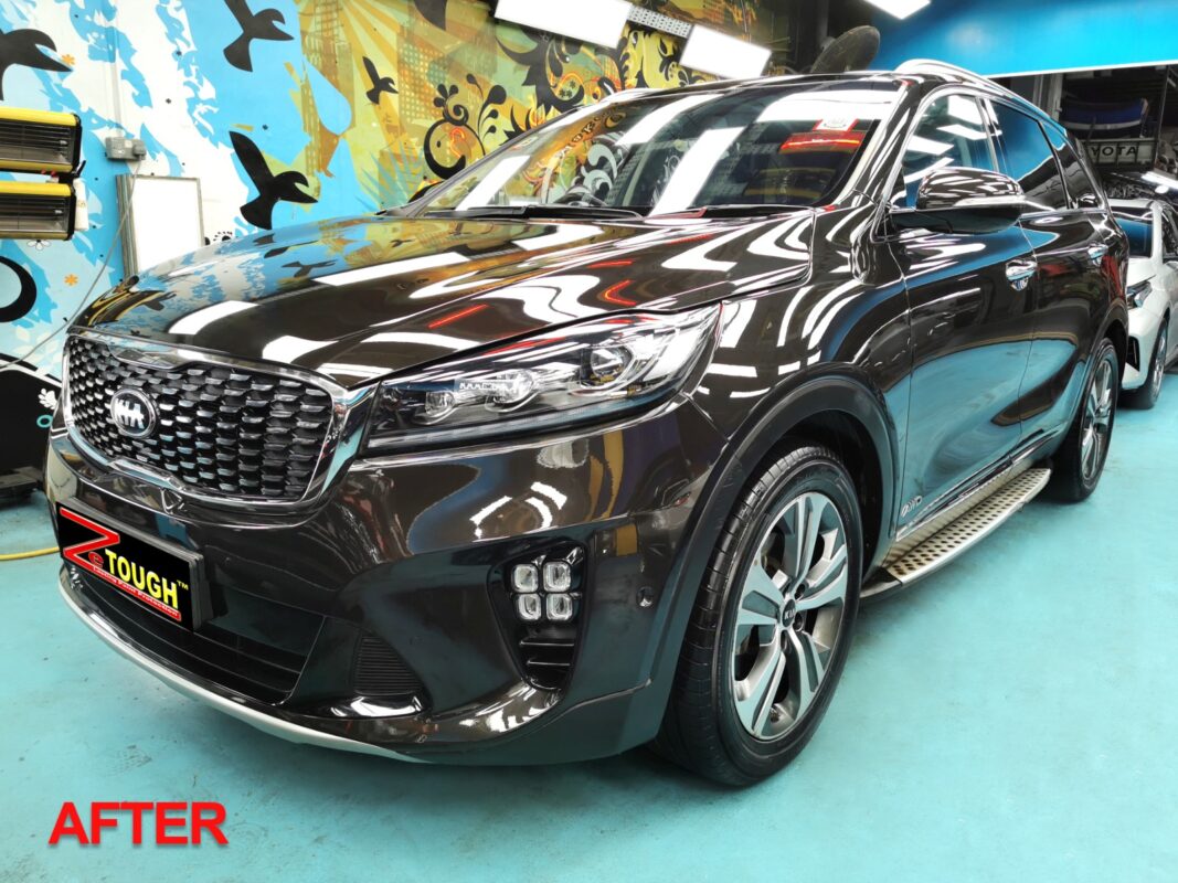 Black Kia Sorento SUV, glossy after its full respray.