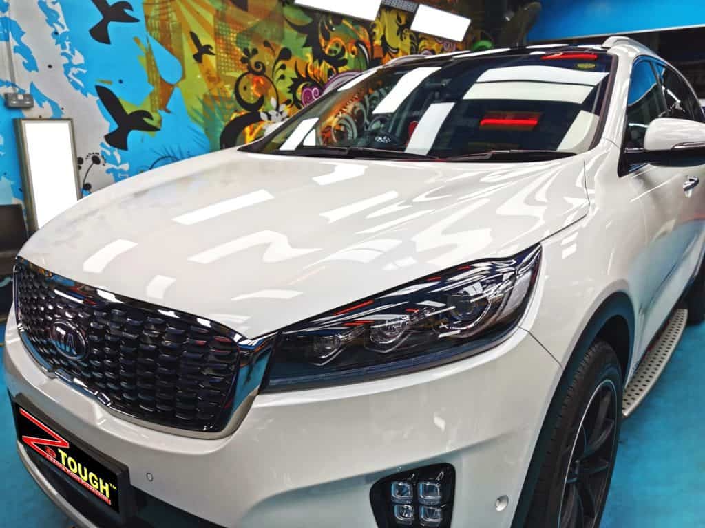 The Kia Sorento from a side angle after the ceramic coating.