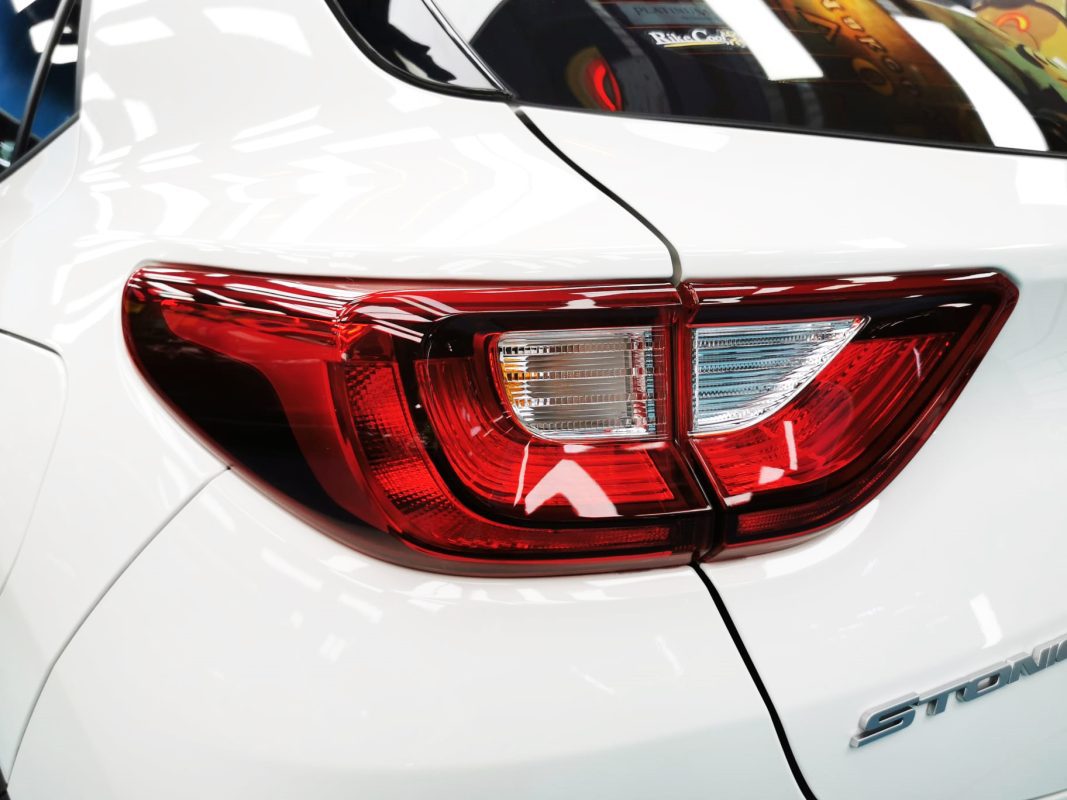 The coated bonnet of the Stonic under workshop lighting.