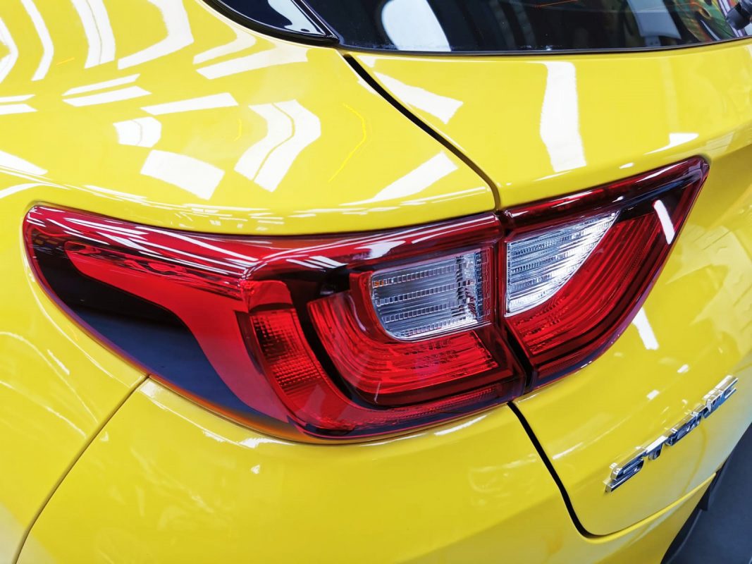 The coated bonnet of the Kia Stonic under workshop lighting.