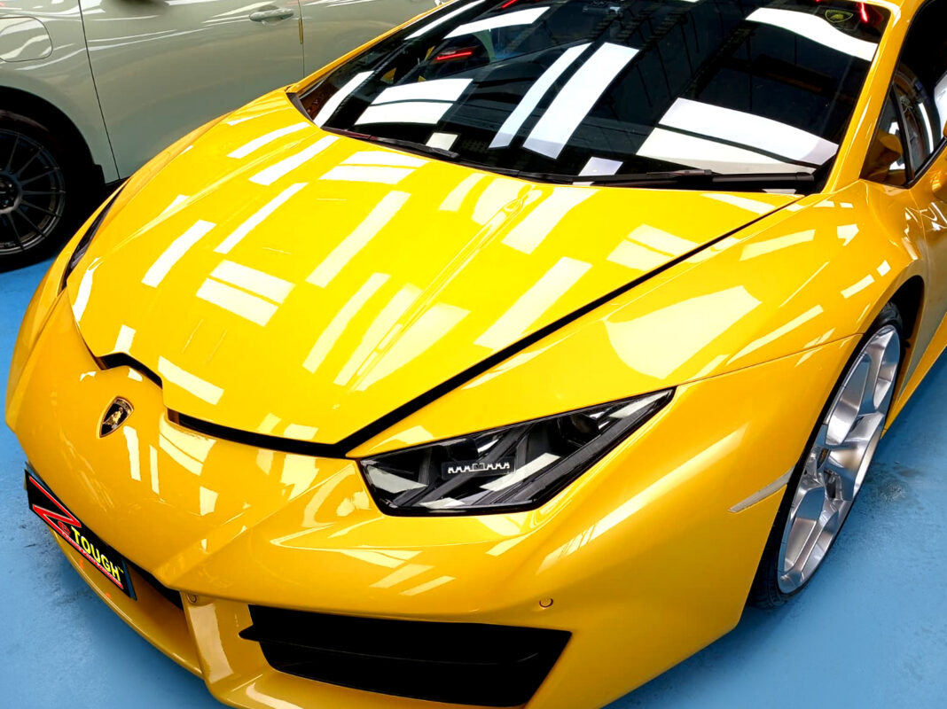 The Lamborghini Huracan's coated paintwork under workshop lighting.