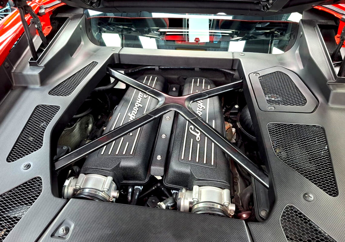 Reflections across the coated panels of the Lamborghini Huracan.