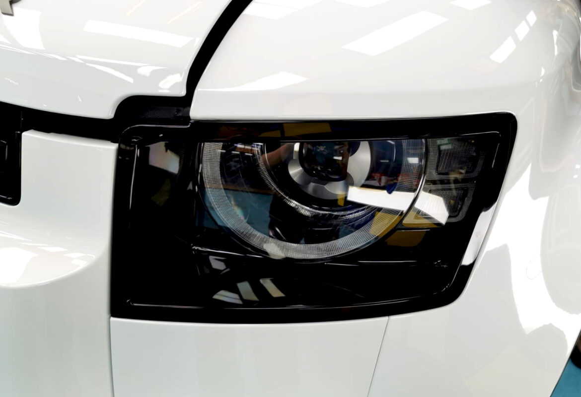 The Defender's coated paintwork showing clean reflections.