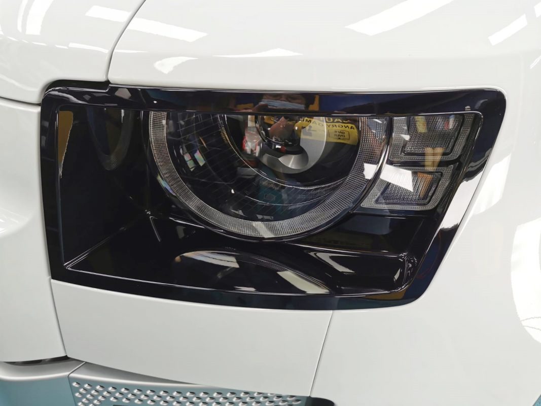 The Defender's coated paintwork showing clean reflections.