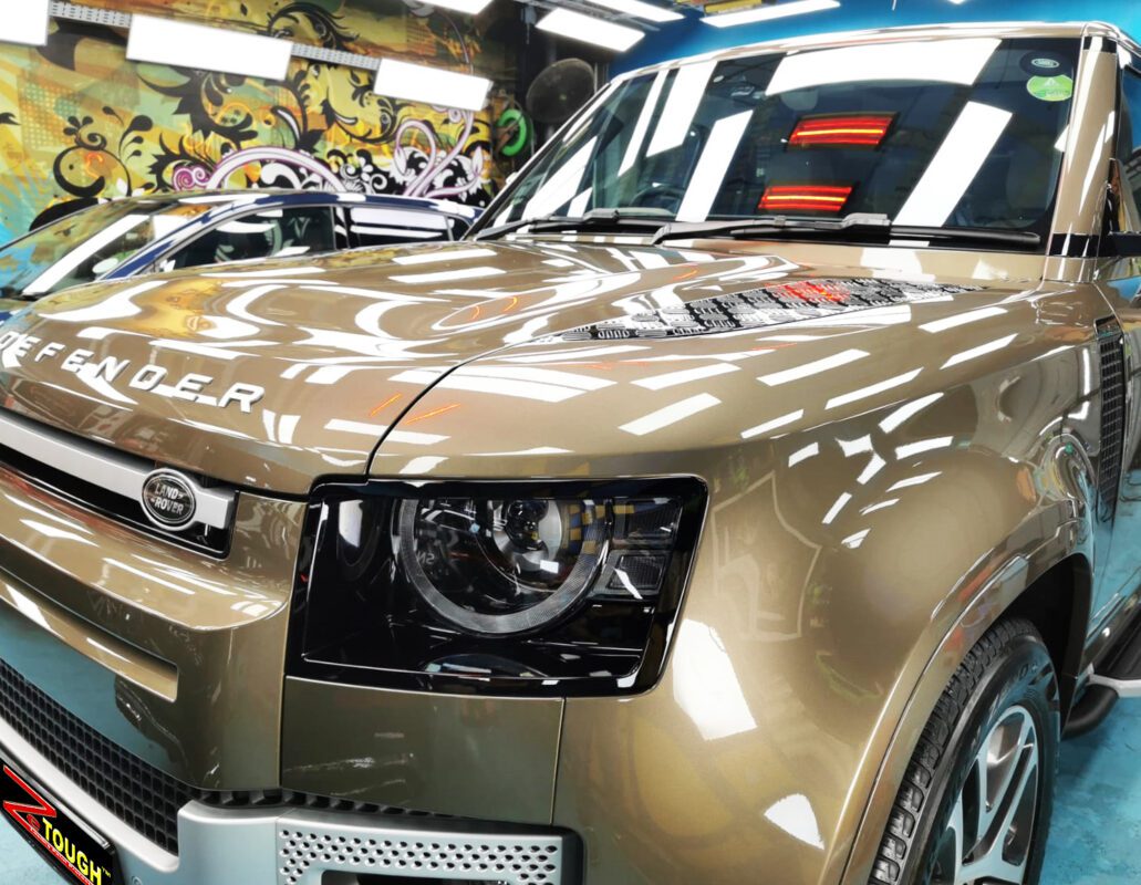 The Land Rover Defender from a side angle after the ceramic coating.
