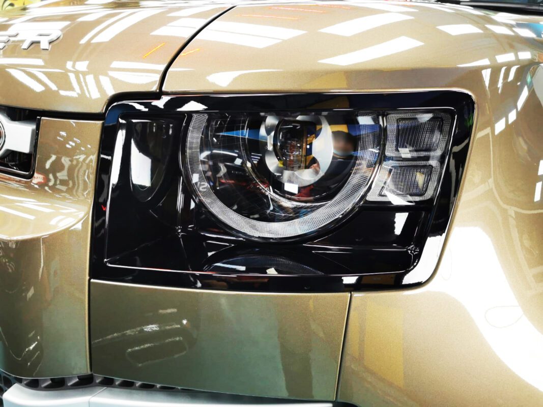 The Defender's coated paintwork showing clean reflections.