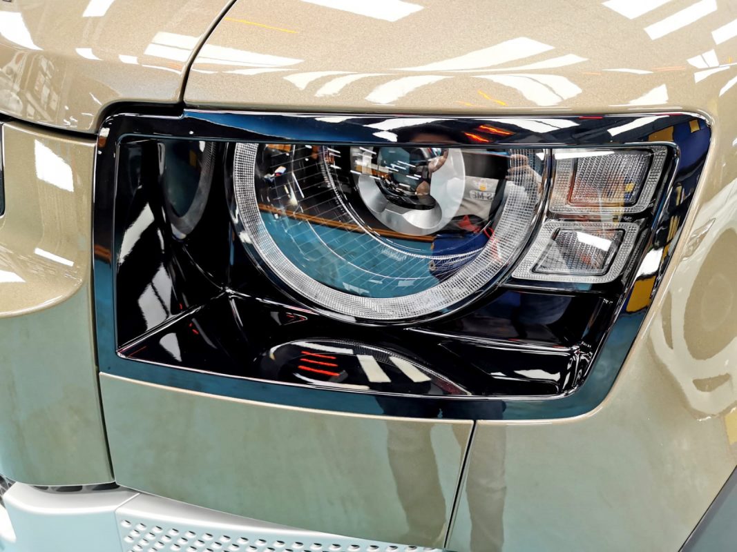 The Defender's coated paintwork showing clean reflections.