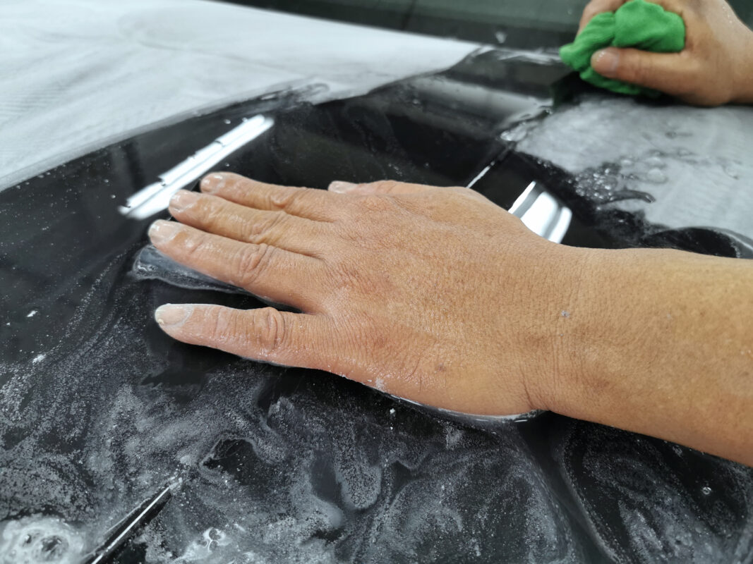 A panel on the Land Rover Discovery after wet-sanding, surface smooth and level.