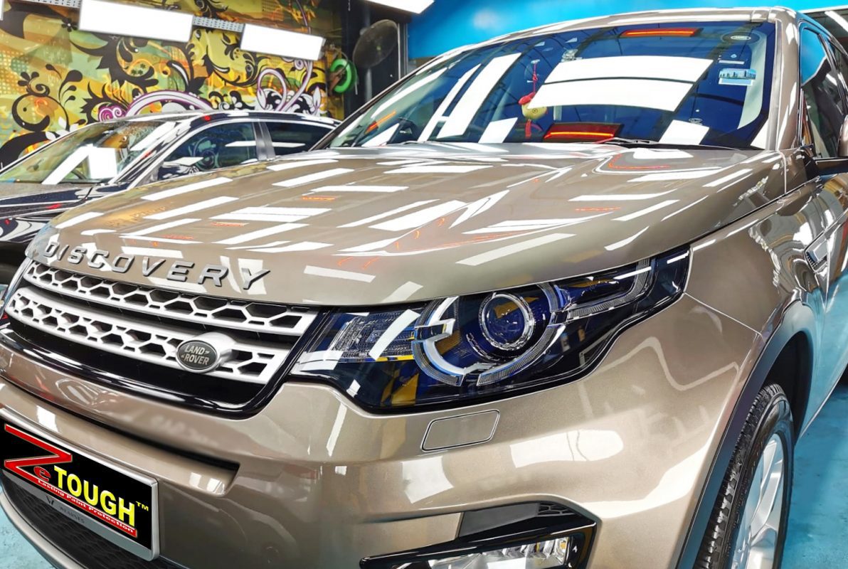 The Land Rover Discovery Sport from a side angle after the titanium coating.
