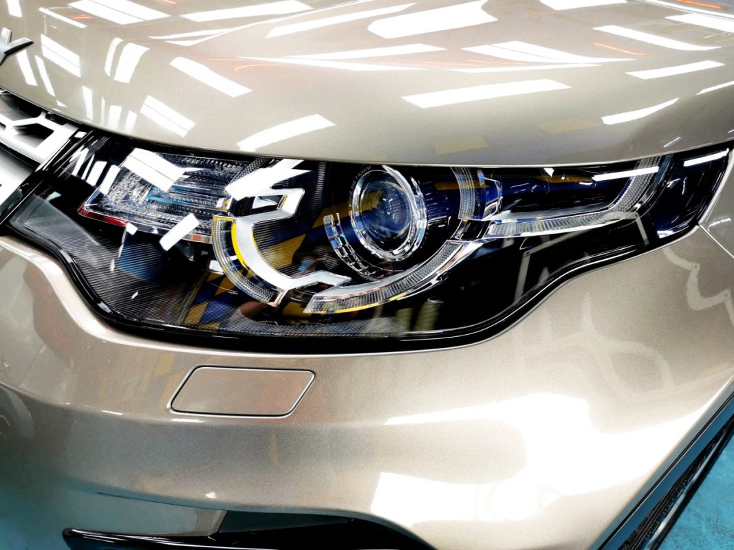 The Discovery Sport's coated paintwork showing clean reflections.