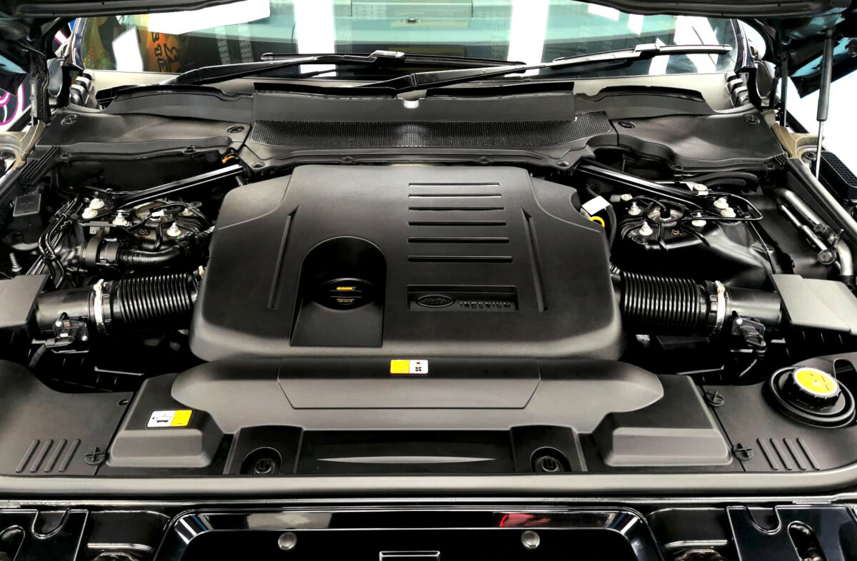 Reflections across the coated panels of the Range Rover.