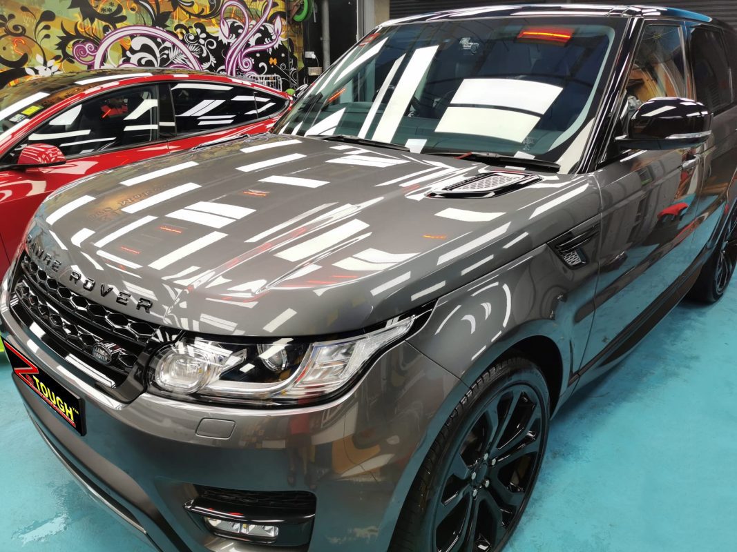 The Range Rover from a side angle after the ceramic coating.
