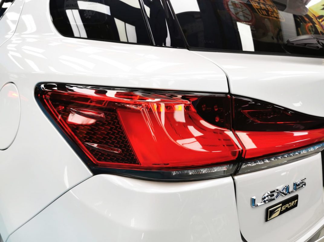The coated bonnet of the Lexus CT200h under workshop lighting.