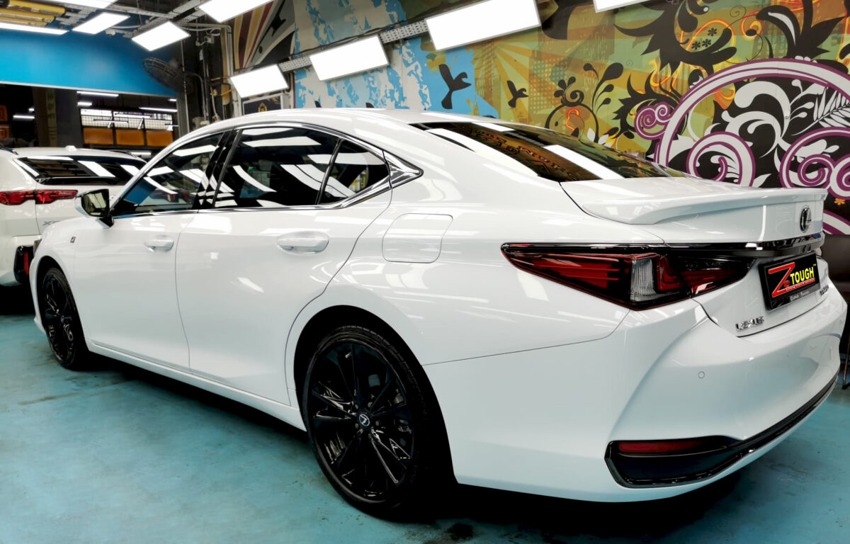 Rear quarter of the ES F-Sport, glossy and protected.