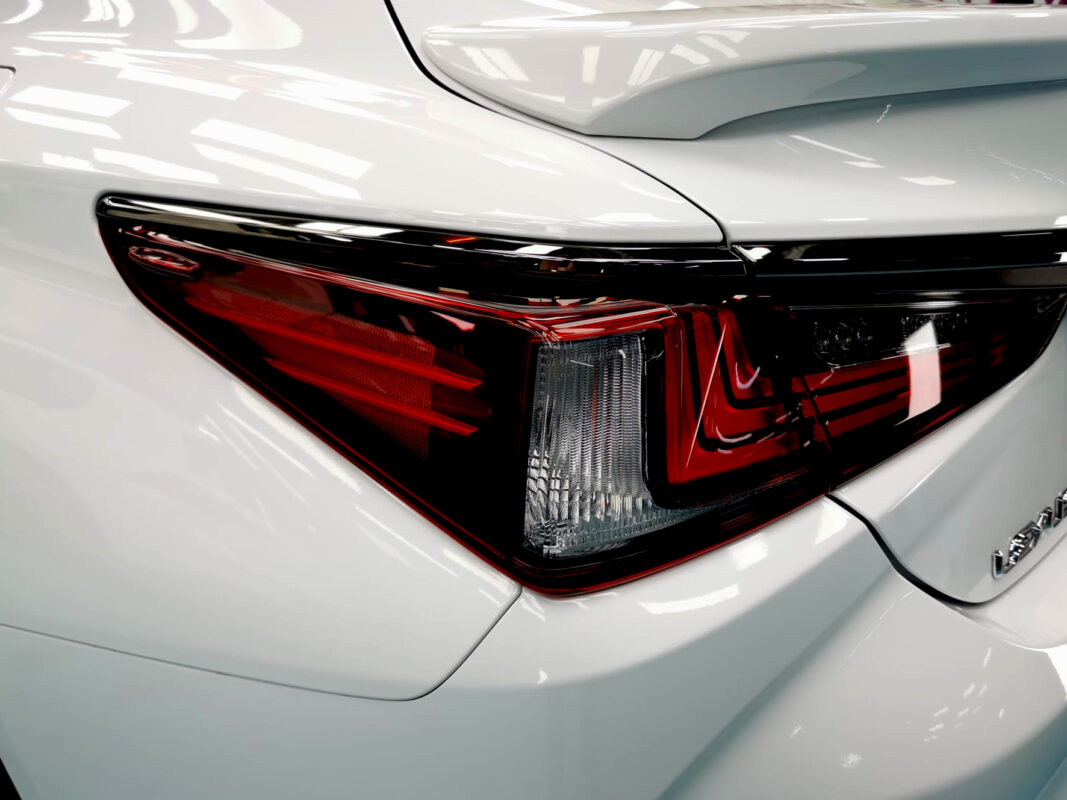 The coated bonnet of the ES F-Sport under workshop lighting.