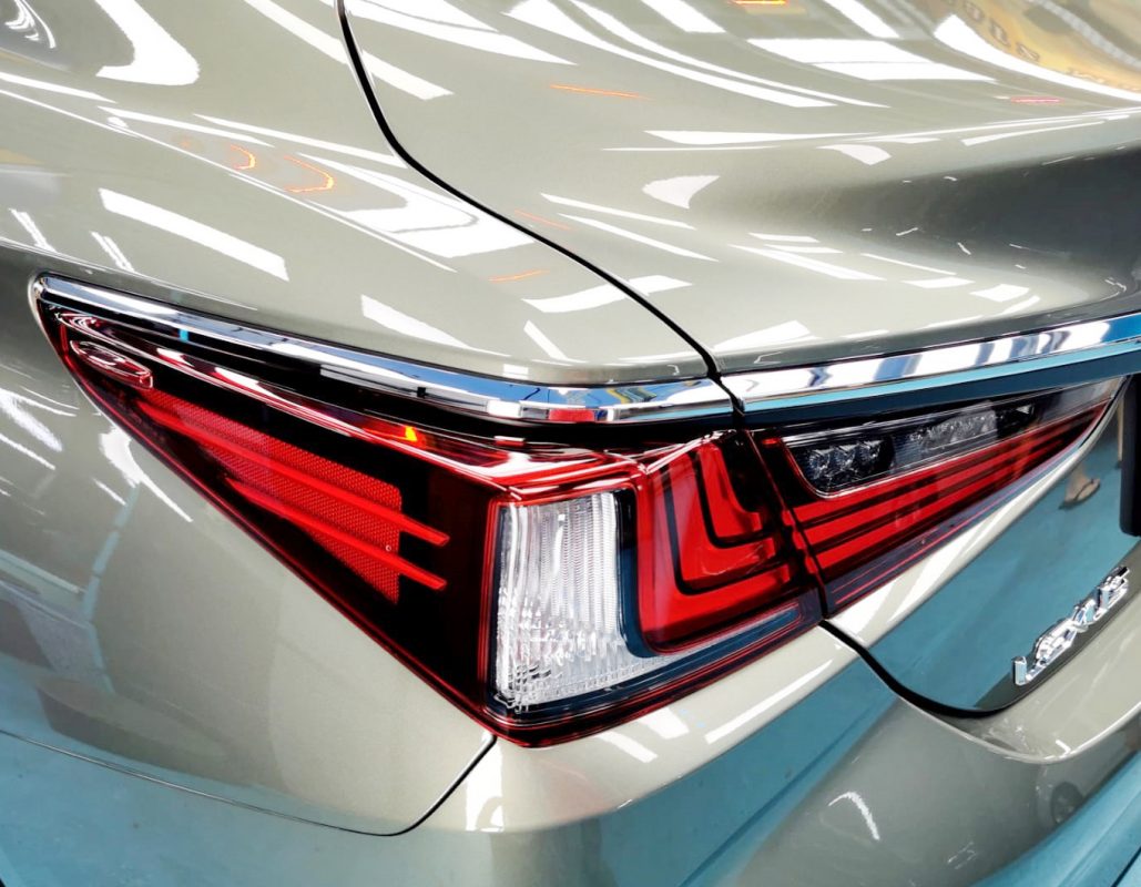 The coated bonnet of the Lexus ES250 under workshop lighting.