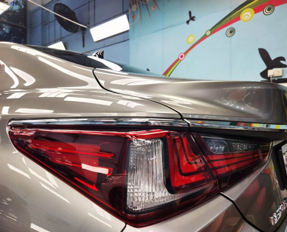 The coated bonnet of the Lexus ES250 under workshop lighting.