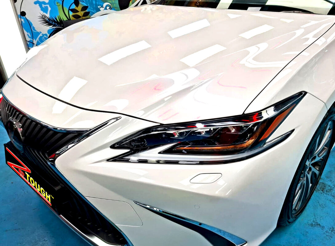 The Lexus ES250's coated paintwork under workshop lighting.