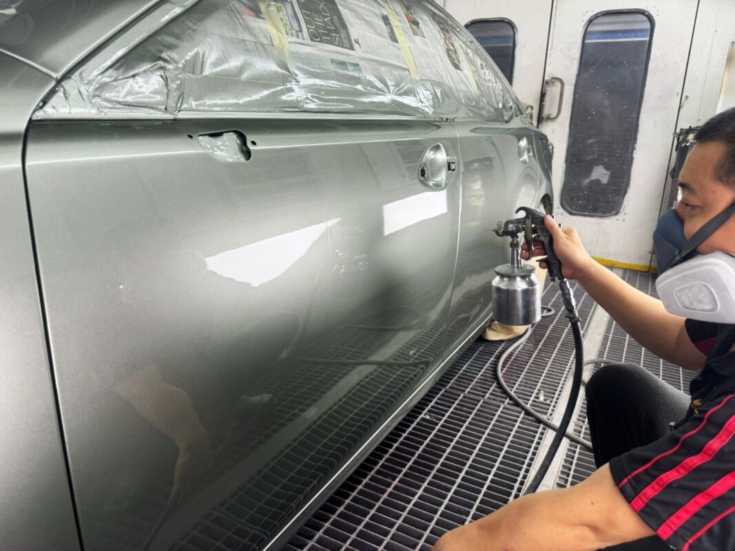 The Lexus ES300H after spraying, being wet-sanded back.
