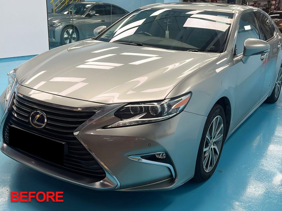 Before: the Lexus ES300h at the start, with dull, scratched, and peeling paintwork.