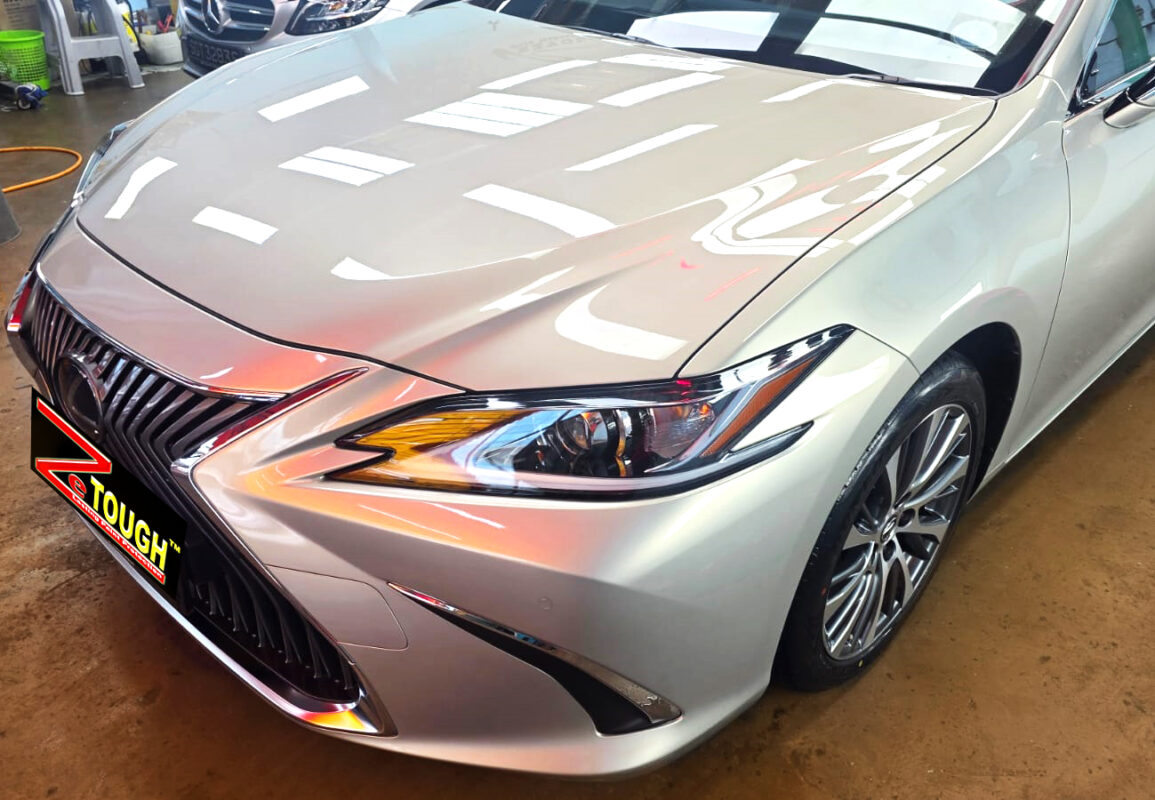 The Lexus ES300h's coated paintwork under workshop lighting.