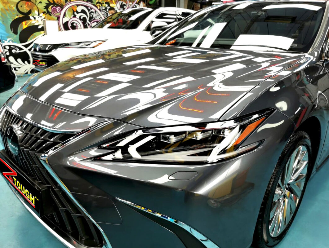 The Lexus ES300h's coated paintwork under workshop lighting.