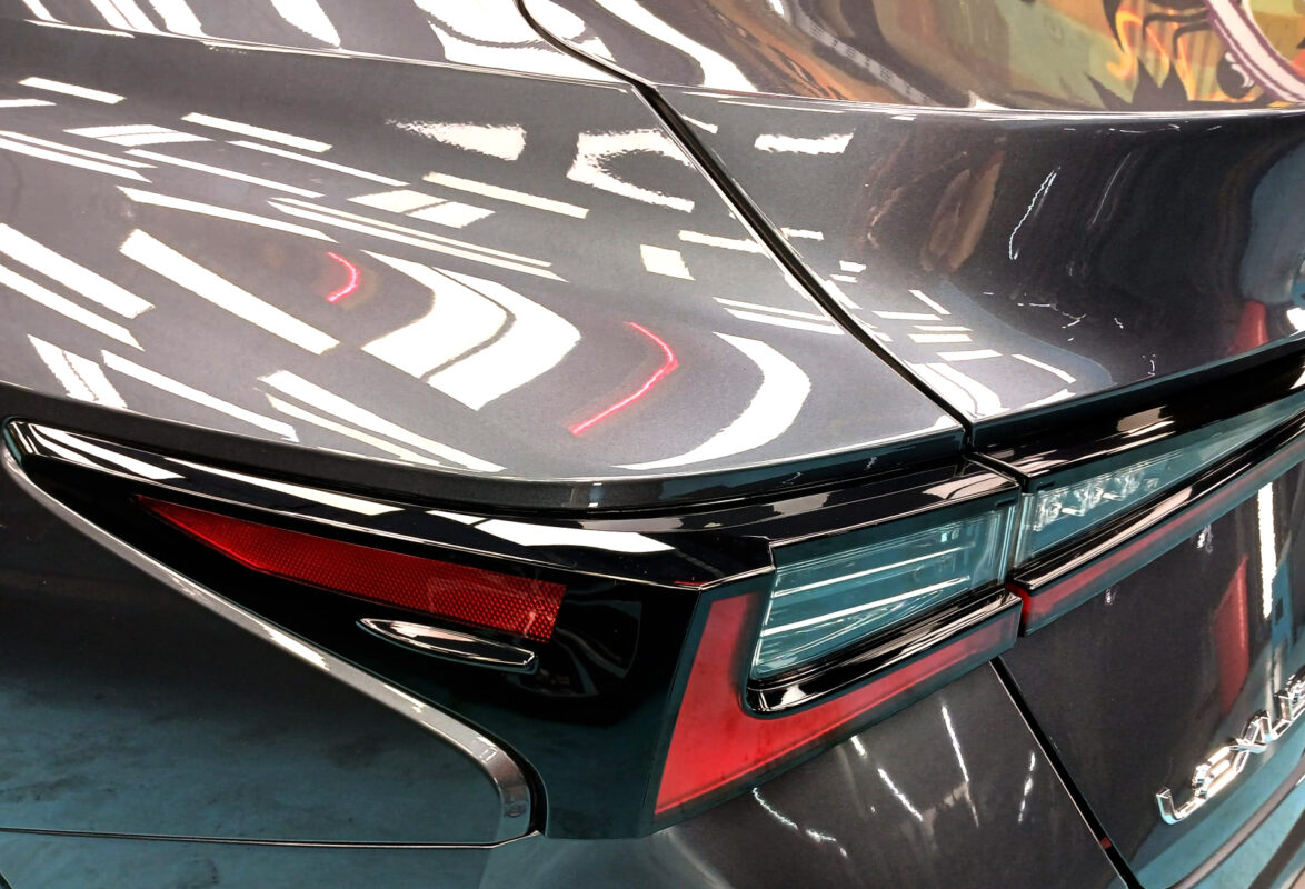 Rear quarter of the IS300h, glossy and protected.