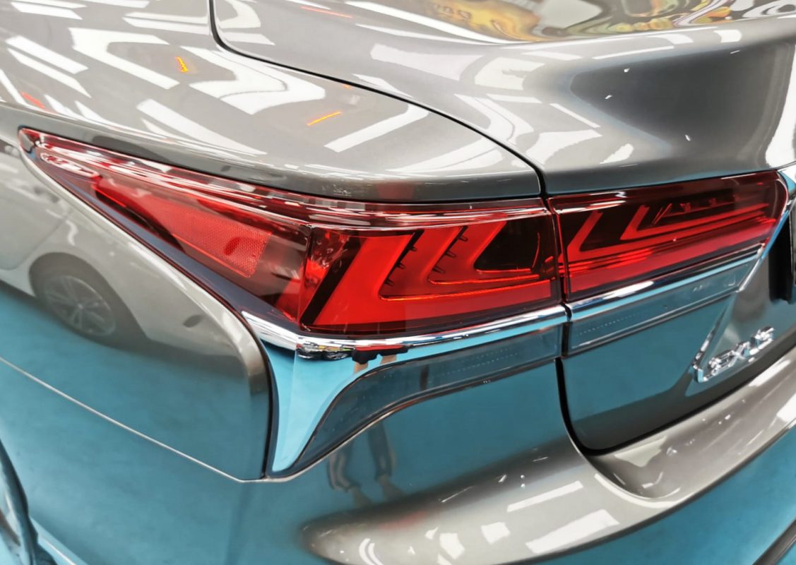 The coated bonnet of the Lexus LS350 under workshop lighting.