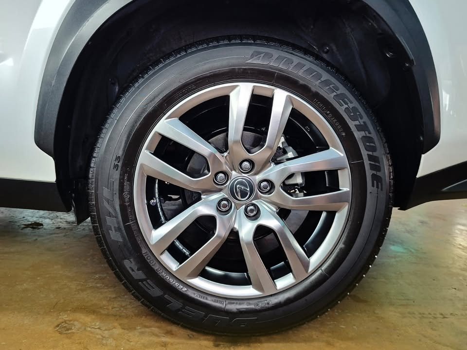 Silver alloy wheel with a Bridgestone tyre on the Lexus NX.