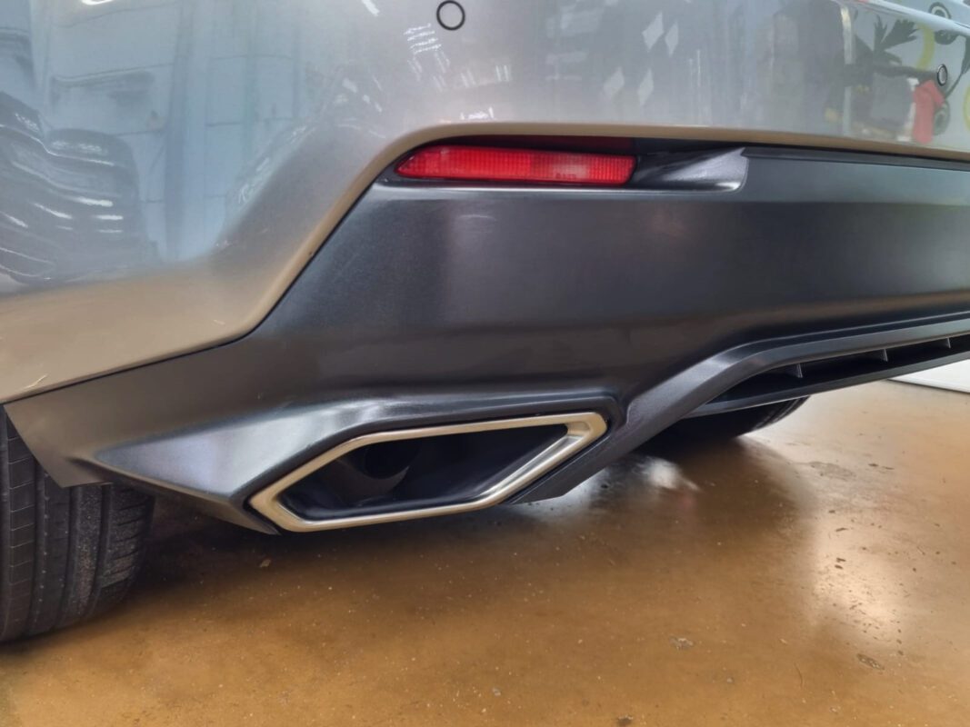 Rear quarter of the NX300, glossy and protected.