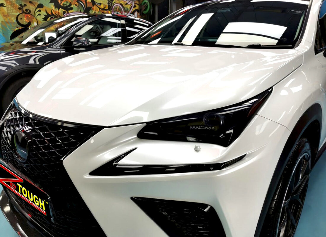 The Lexus NX300's coated paintwork under workshop lighting.