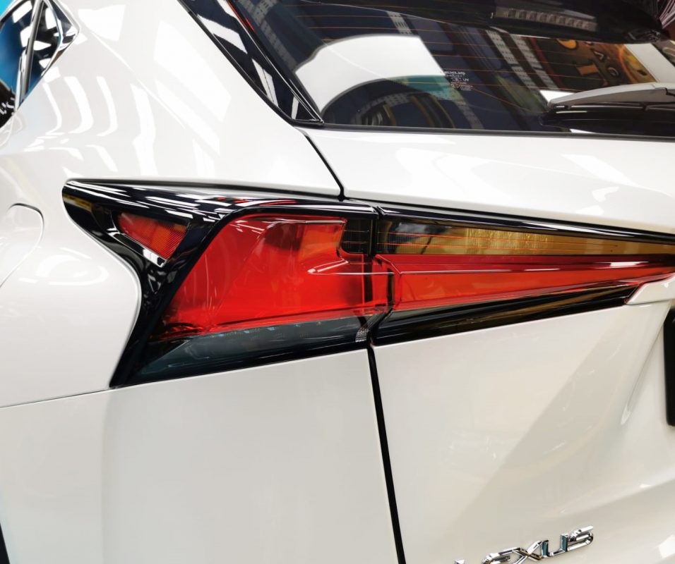 The coated bonnet of the Lexus NX300 under workshop lighting.