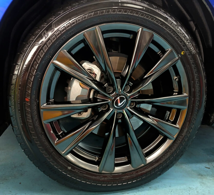 The coated bonnet of the NX350 under workshop lighting.
