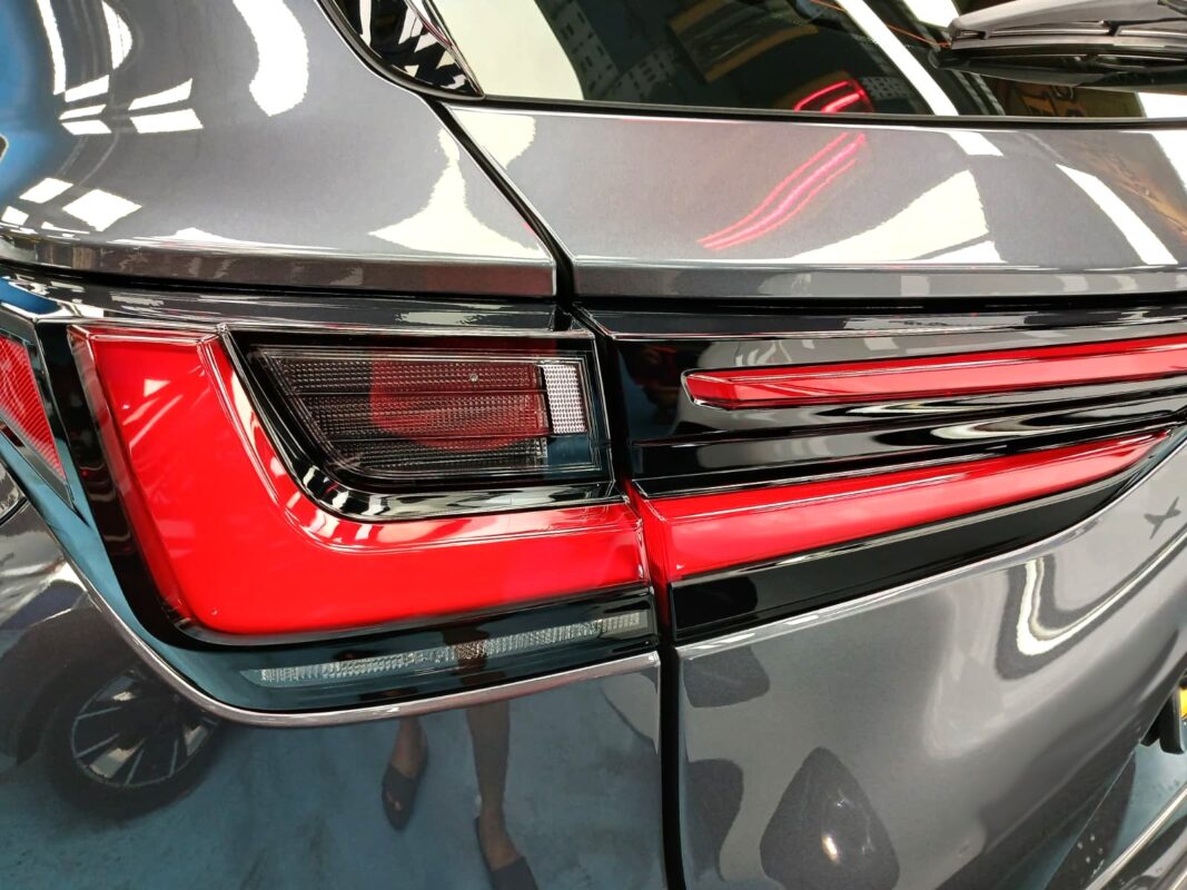 The coated bonnet of the NX350h under workshop lighting.