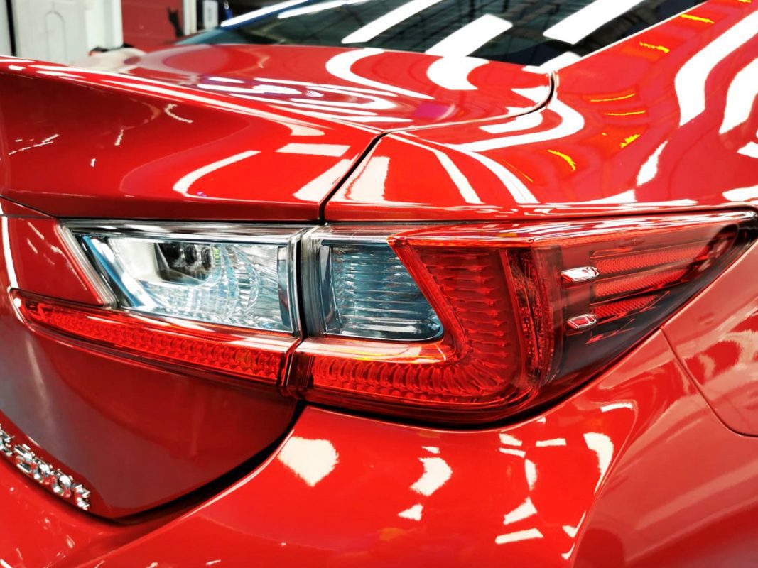 The coated bonnet of the Lexus RC200T under workshop lighting.