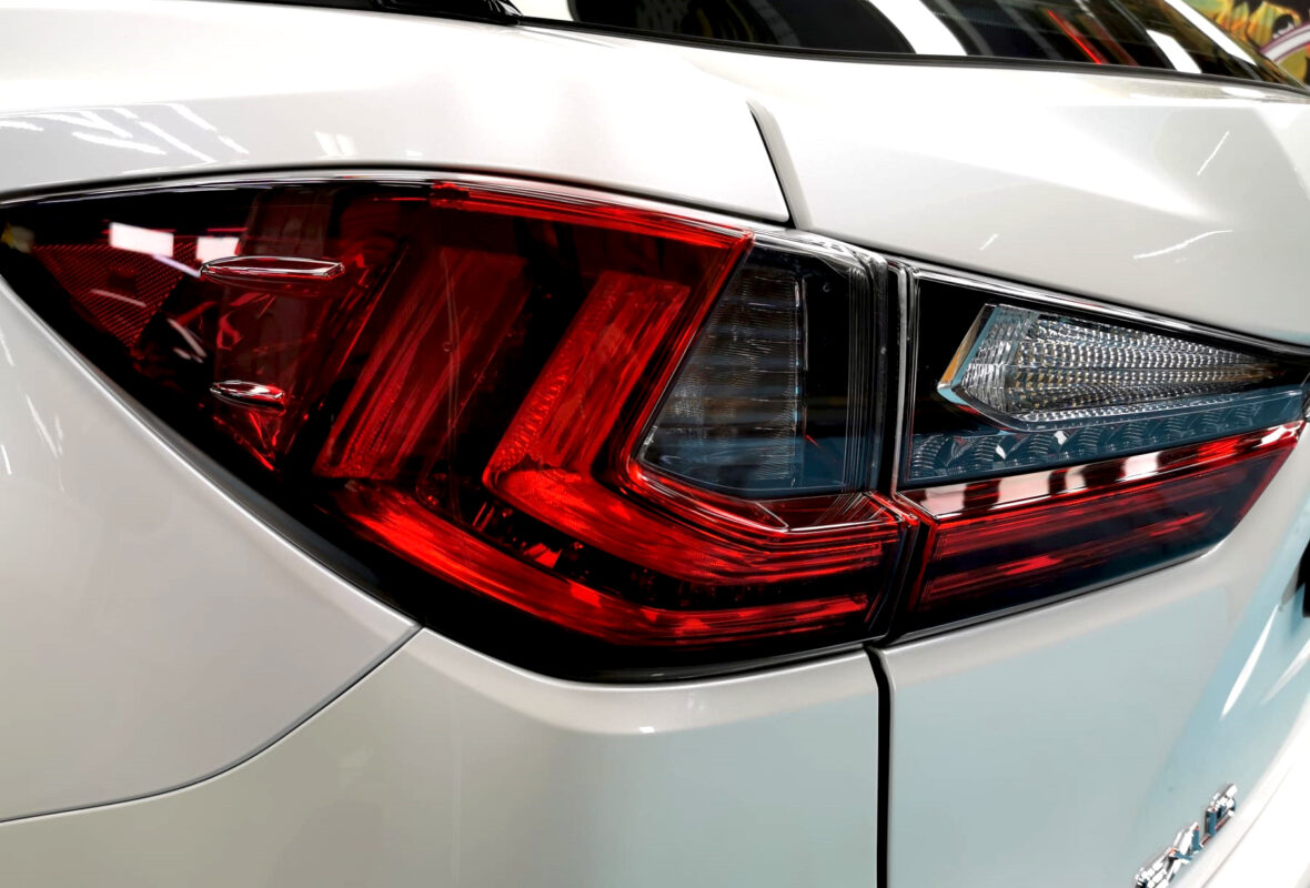 The coated bonnet of the RX200t under workshop lighting.