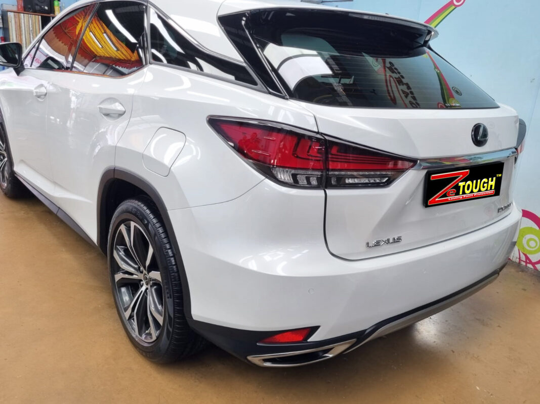 Rear quarter of the Lexus RX300, glossy and protected.