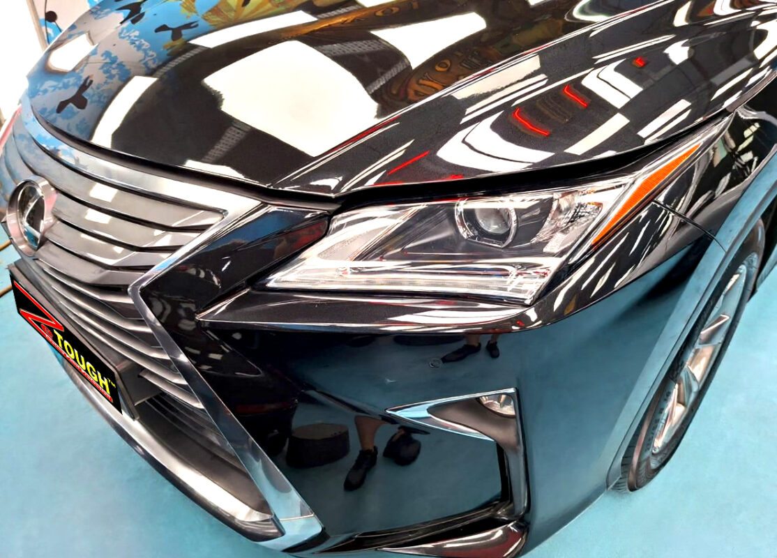 The Lexus RX300's coated paintwork under workshop lighting.