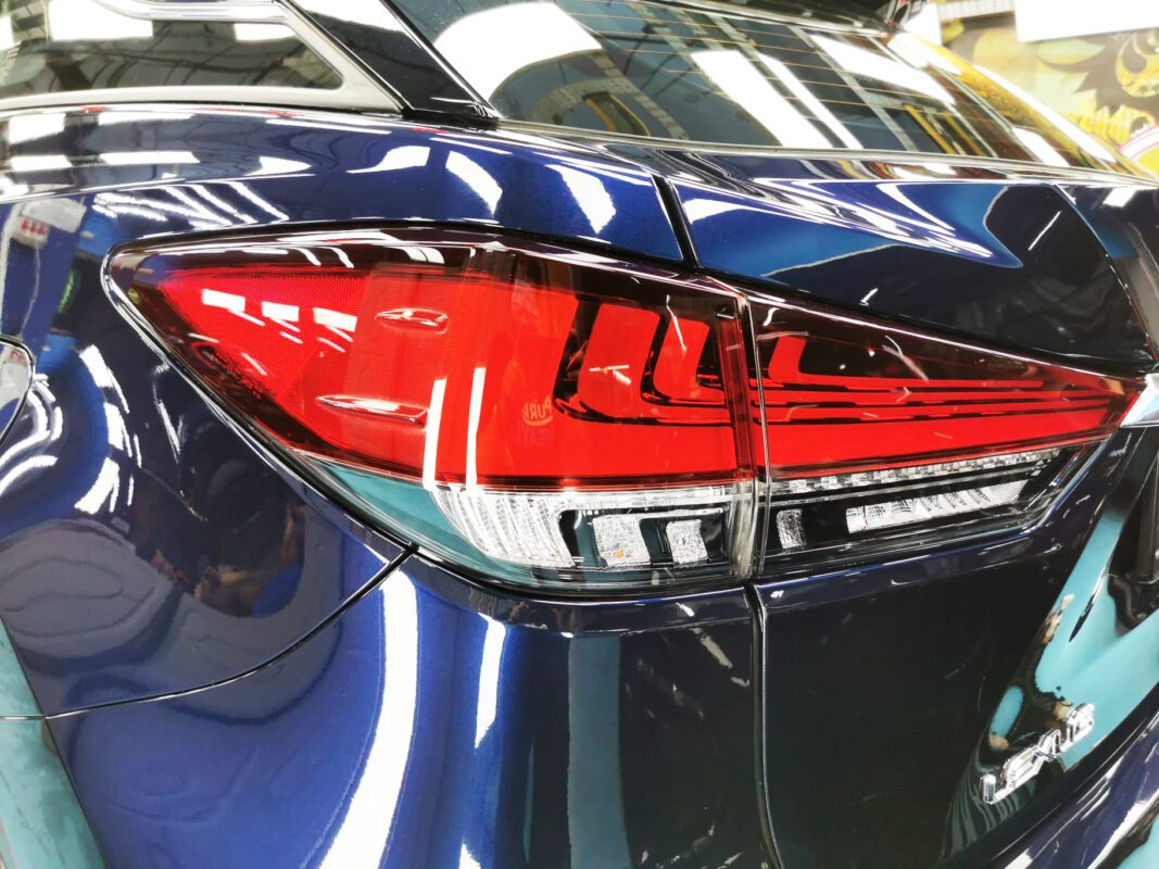 The coated bonnet of the RX300 under workshop lighting.
